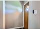 A view of the entryway with an outside door and light switch at 9221 High St, Thornton, CO 80229