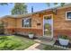 Inviting entryway with a decorative door and manicured landscaping at 9221 High St, Thornton, CO 80229