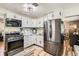 Efficient kitchen with stainless steel appliances and plenty of counter space at 9221 High St, Thornton, CO 80229