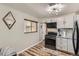 Well-equipped kitchen with modern appliances and sleek cabinetry at 9221 High St, Thornton, CO 80229