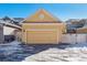 Attached garage with a yellow door at 10843 Belle Creek Blvd, Commerce City, CO 80640