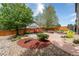 Backyard featuring a fire pit, seating area, landscaping, rocks, and a privacy fence at 11460 W Tanforan Cir, Littleton, CO 80127