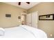 Bedroom featuring a closet and a bed with a white comforter. The walls are painted a neutral color at 11460 W Tanforan Cir, Littleton, CO 80127