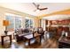 This open-concept living room features a seamless transition into the kitchen, perfect for modern living at 11460 W Tanforan Cir, Littleton, CO 80127