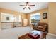 Comfortable seating area with a plush sofa and a scenic view from the window at 11460 W Tanforan Cir, Littleton, CO 80127