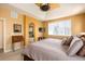 Comfortable primary bedroom featuring large windows with natural light, and bath access at 11460 W Tanforan Cir, Littleton, CO 80127