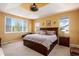 Spacious main bedroom featuring a large bed, modern furniture, and scenic outdoor views at 11460 W Tanforan Cir, Littleton, CO 80127