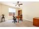 This home office offers a functional workspace with natural light and neutral tones for productivity at 11460 W Tanforan Cir, Littleton, CO 80127