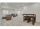 Finished basement with neutral carpet, entertainment space, bar with stools, and recessed lighting at 7325 S Waterloo Way, Aurora, CO 80016