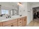 Modern bathroom with double sinks, quartz countertops, and a glass-enclosed shower at 7325 S Waterloo Way, Aurora, CO 80016