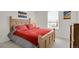 Cozy bedroom with rustic decor and a comfortable bed with decorative pillows at 7325 S Waterloo Way, Aurora, CO 80016