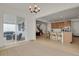 Spacious eat-in dining area with sliding glass doors to outdoor seating and an adjacent modern kitchen at 7325 S Waterloo Way, Aurora, CO 80016