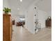 Bright and airy living room featuring hardwood floors, and view of the staircase at 7325 S Waterloo Way, Aurora, CO 80016