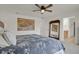 Bright and spacious main bedroom with stylish decor and an ensuite bathroom at 7325 S Waterloo Way, Aurora, CO 80016