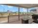 Covered patio featuring comfortable seating, a fire pit, and neighborhood views at 7325 S Waterloo Way, Aurora, CO 80016