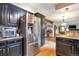 Modern kitchen features stainless steel appliances and sleek black cabinetry at 170 Dover Ct, Castle Pines, CO 80108