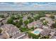 Aerial view of the residential community showcasing well-maintained landscaping, pool, and surrounding neighborhood at 8707 E Florida Ave # 614, Denver, CO 80247