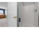 Walk in shower with white tiles at 8707 E Florida Ave # 614, Denver, CO 80247