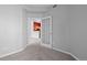 Bedroom doorway with carpeted floors and view of the kitchen at 8707 E Florida Ave # 614, Denver, CO 80247