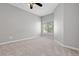 Bedroom with neutral carpet, a window, and light gray walls at 8707 E Florida Ave # 614, Denver, CO 80247