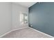 Bedroom with neutral carpet, a window, and a painted accent wall at 8707 E Florida Ave # 614, Denver, CO 80247