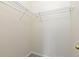 Walk-in closet featuring white wire shelving and neutral-toned walls at 8707 E Florida Ave # 614, Denver, CO 80247
