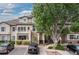 Attractive townhome with a cozy balcony, lush landscaping, and convenient parking spaces at 8707 E Florida Ave # 614, Denver, CO 80247