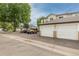 Exterior view of the building showcasing garages and parking spaces at 8707 E Florida Ave # 614, Denver, CO 80247