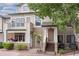 Charming townhome featuring a front patio with beautiful flower planters and a welcoming entrance at 8707 E Florida Ave # 614, Denver, CO 80247