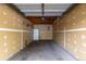 Empty garage with concrete floor and white-painted drywall at 8707 E Florida Ave # 614, Denver, CO 80247