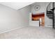 Bright living room featuring a modern design with spiral staircase access and views of the kitchen at 8707 E Florida Ave # 614, Denver, CO 80247