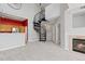 Spacious living room featuring a fireplace and spiral staircase with access to kitchen and other rooms at 8707 E Florida Ave # 614, Denver, CO 80247