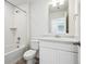 A classic white bathroom with a shower/tub combo, and a single vanity at 18712 E 99Th Ave, Commerce City, CO 80022