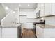 Kitchen with granite counters, stainless steel appliances, subway tile backsplash, and wood floors at 18712 E 99Th Ave, Commerce City, CO 80022