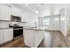 Kitchen with stainless steel appliances, granite countertops, and island at 18712 E 99Th Ave, Commerce City, CO 80022