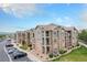 Apartment building featuring beautiful stone and siding and inviting outdoor balconies at 1425 Blue Sky Cir # 15-301, Erie, CO 80516