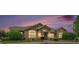 Clubhouse exterior with beautiful stone and siding, a well-manicured lawn, and inviting entrance at 1425 Blue Sky Cir # 15-301, Erie, CO 80516