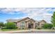 Clubhouse exterior with beautiful stone and siding, a well-manicured lawn, and inviting entrance at 1425 Blue Sky Cir # 15-301, Erie, CO 80516