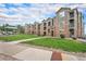 Apartment building featuring beautiful stone and siding, a community gazebo and manicured lawn at 1425 Blue Sky Cir # 15-301, Erie, CO 80516
