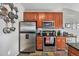 Modern kitchen featuring stainless steel appliances, granite countertops, and ample storage space at 1425 Blue Sky Cir # 15-301, Erie, CO 80516