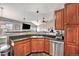 Functional kitchen featuring granite countertops, stainless steel appliances, and seamless flow to the living spaces at 1425 Blue Sky Cir # 15-301, Erie, CO 80516