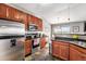 Stylish kitchen featuring stainless steel appliances, granite countertops, and an adjoining dining area at 1425 Blue Sky Cir # 15-301, Erie, CO 80516