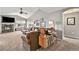 Cozy living room with a fireplace, large windows, and a stylish entertainment unit for a relaxing atmosphere at 1425 Blue Sky Cir # 15-301, Erie, CO 80516