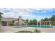 Community pool featuring lush landscaping and a pergola covered seating area at 1425 Blue Sky Cir # 15-301, Erie, CO 80516