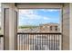 Balcony view of community, garages, and the Rocky Mountains in the distance at 1425 Blue Sky Cir # 15-301, Erie, CO 80516