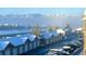 Beautiful winter scene with snow-covered buildings and mountains at 1425 Blue Sky Cir # 15-301, Erie, CO 80516