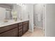 Double sink bathroom with two mirrors and a separate toilet space at 2225 Santini Trl # C, Littleton, CO 80129