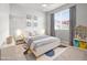 Bright bedroom with a bed, a window and a shelf for toys at 2225 Santini Trl # C, Littleton, CO 80129