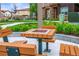 Cozy community area with outdoor table and benches, great for gatherings and outdoor dining at 2225 Santini Trl # C, Littleton, CO 80129