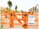 Well-maintained dog park featuring secure fencing, gravel ground, and park rules for pet owners at 2225 Santini Trl # C, Littleton, CO 80129